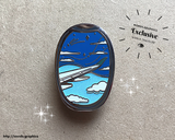 front view of day skies Window Seat Enamel Pin