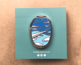 Day skies window seat view Enamel pin with backing card